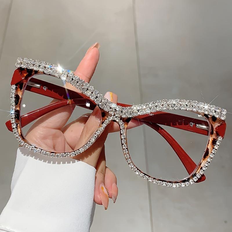 A Pair of Women'S Stylish Cat-Eye Glasses Adorned with Rhinestones
