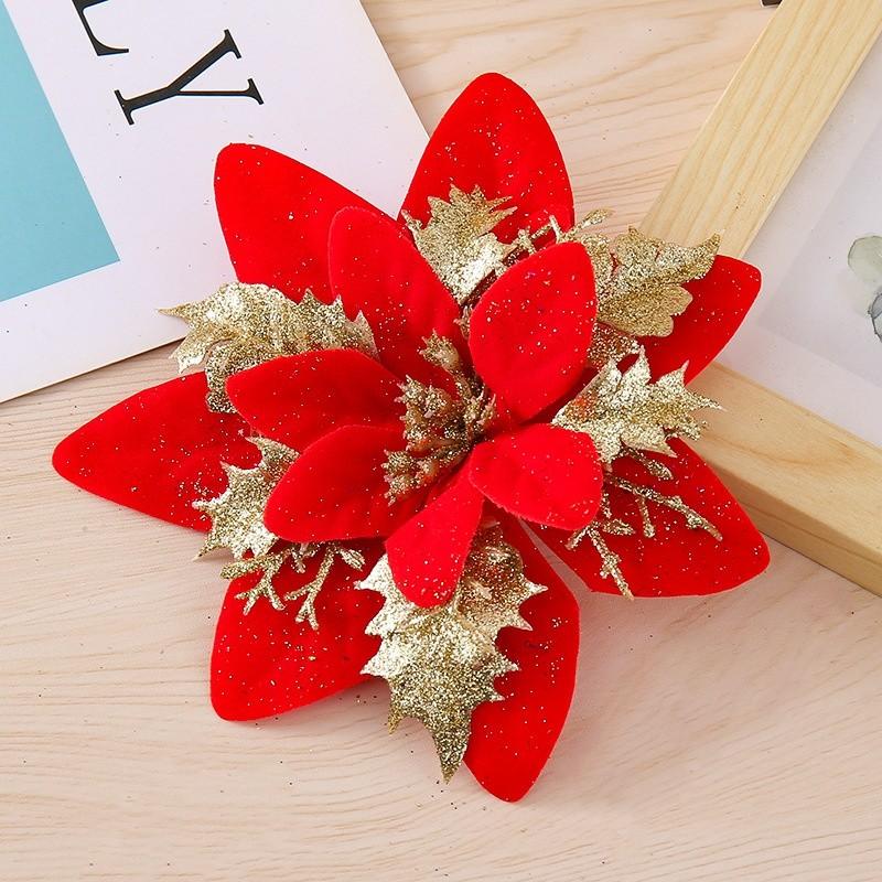 Weihnachtsblumen mit goldener und silberner Kunststoffdekoration für Weihnachtsbaum und festliche Dekoration