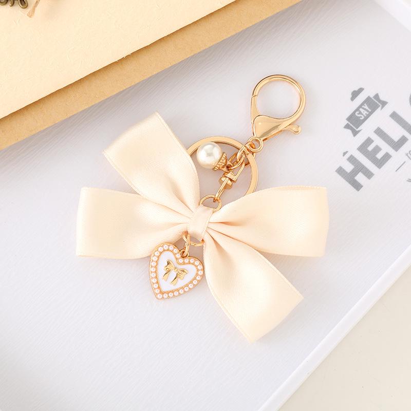 Creatieve Parel Strik Hanger Sleutelhanger: Prachtig Cadeau Accessoire voor Tas of Telefoonhoesje