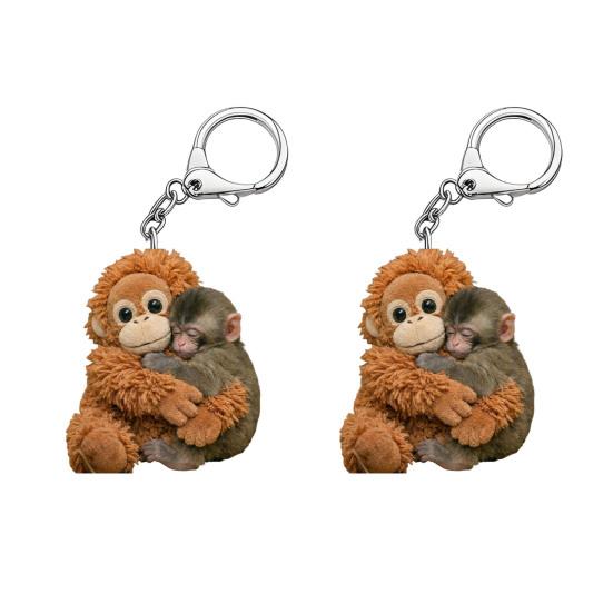 2 Stück Schlüsselanhänger Schlagender Affe Anhänger Schlüsselanhänger Verschleißfest Tasche Rucksack Autoschlüssel Foto Requisite