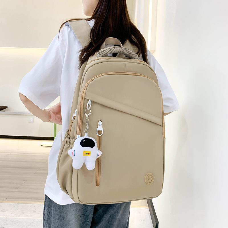 New student schoolbag, girls' large-capacity weight reduction, light solid color simple junior high school backpack