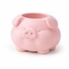 A container in the shape of a plump pink pig