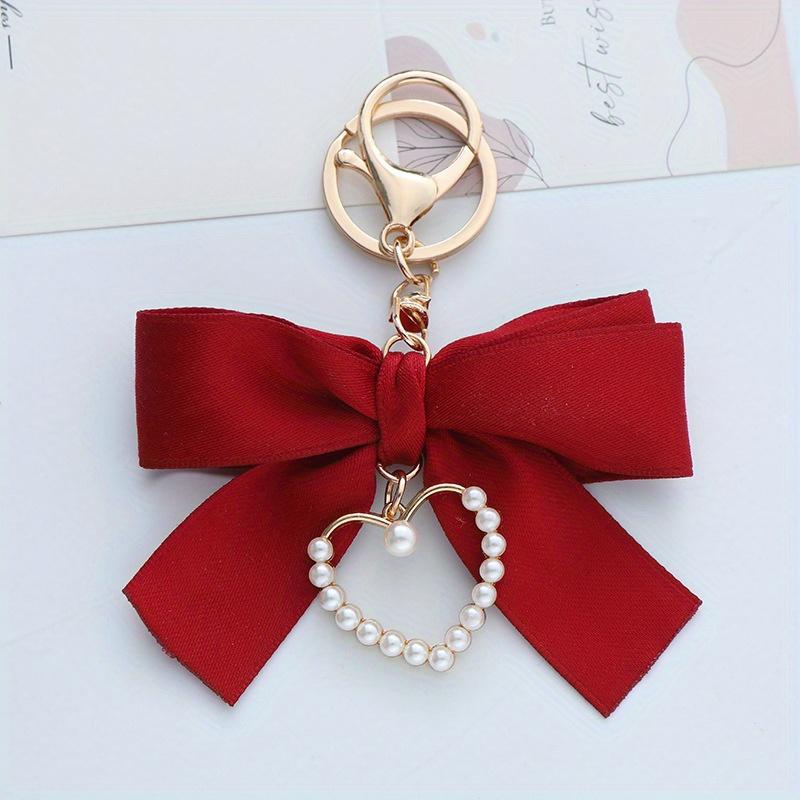 Elegant Pearl Strand Bow Keychain with Heart Charm, Octagonal Shape, Floating Fun-Themed Accessory, with Split Ring Closure for Handbags and Car Keys