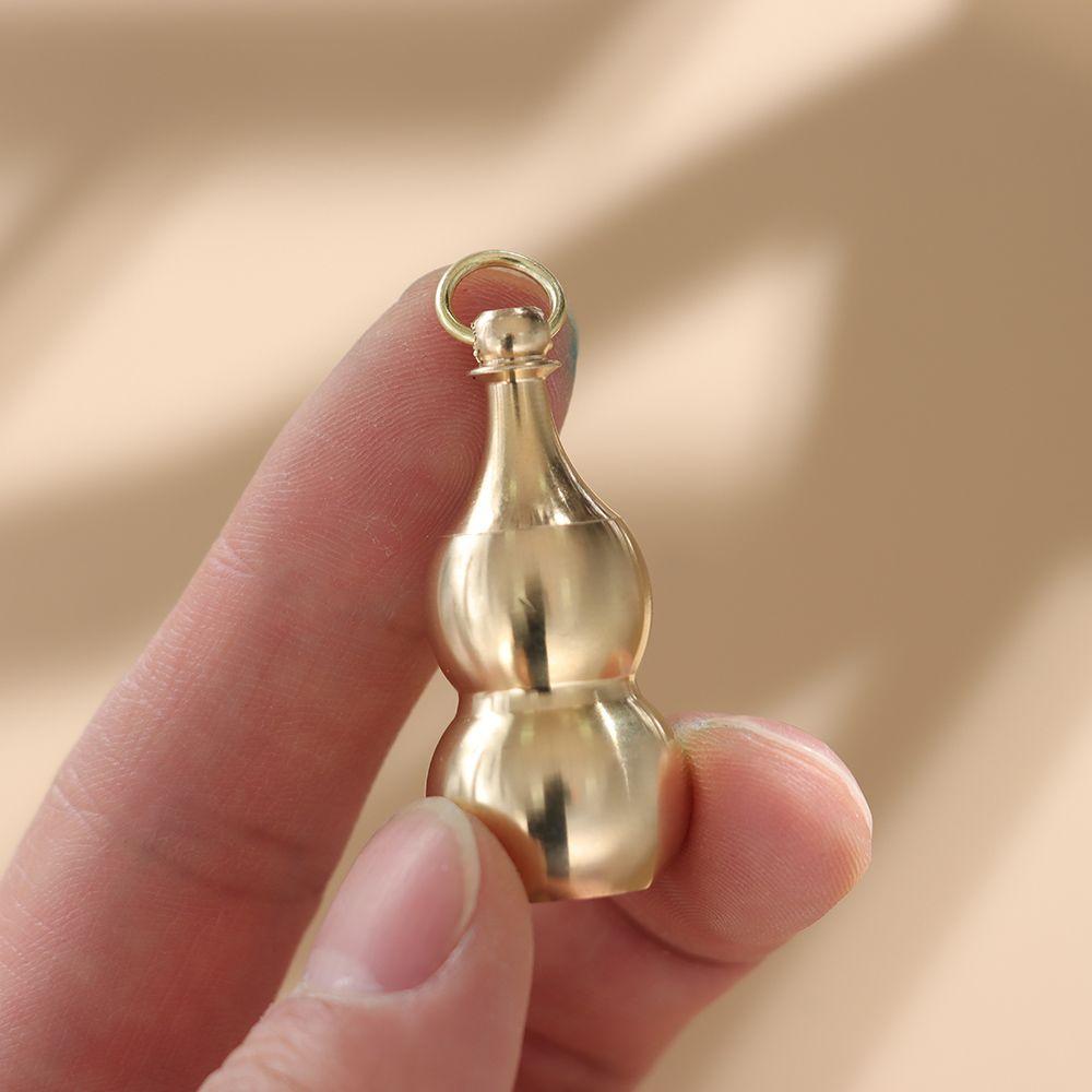 Messingkürbis Anhänger Unregelmäßige Krug Schlüsselanhänger Hängende Halskette Schmuck Wasserdicht Pillendose Medikamentenbehälter Flasche Schlüsselanhänger