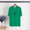 T-shirt a maniche corte con fiocco stampato estivo T-shirt da donna in cotone allentato con scollo a V Pullover grafico estetico chic femminile