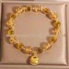Yellow Heart Agate Luminous Bead Bracelet with Gold Foil Fortune Coin Bag Accessories