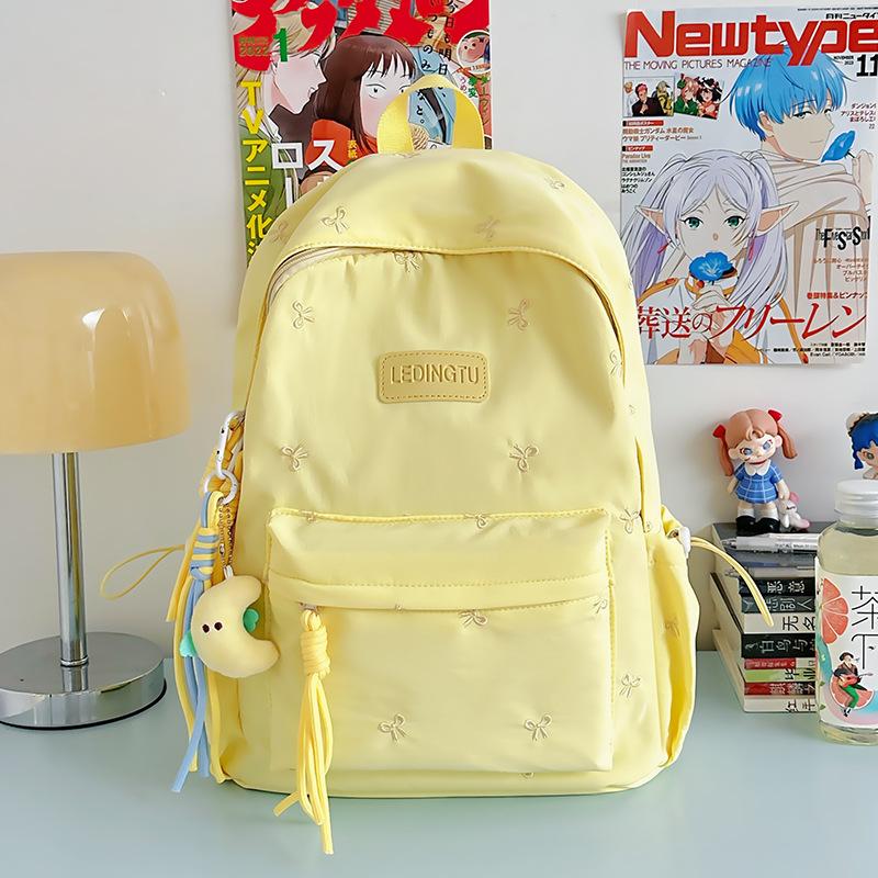 Japanese ins high school student schoolbag female, junior high school student college backpack solid color college student simple versatile backpack