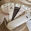 Women's Autumn and Winter Oat Color Small Retro Floral Bow Mid-calf Pile-up Socks