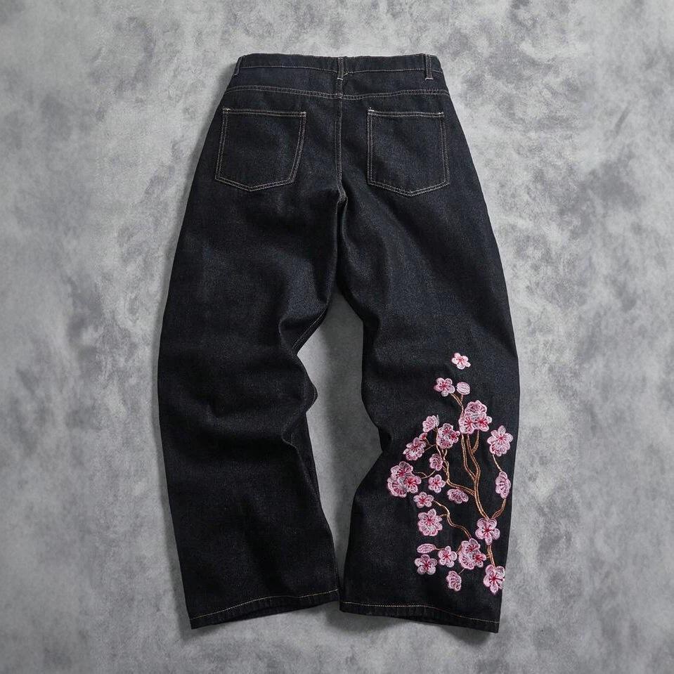 Amerikaanse hiphoppersoonlijkheid straatbloem borduurwerk gewassen oude jeans trend