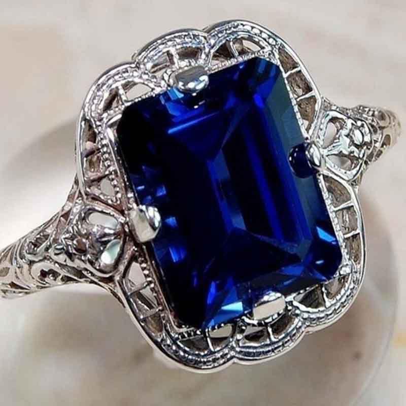 Eleganter europäischer Stil Schmuck Mit klassischem quadratisch geschliffenem blauen Saphir Strassbesetzter Ring