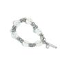 ONGELEGERDE KNOPENKETTING ARMBAND