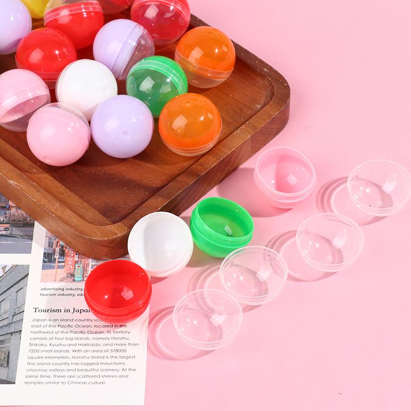 100 Stück leere Spielzeug-Automatenkapseln aus Kunststoff, halb transparent, halbfarbig, runde Kugel