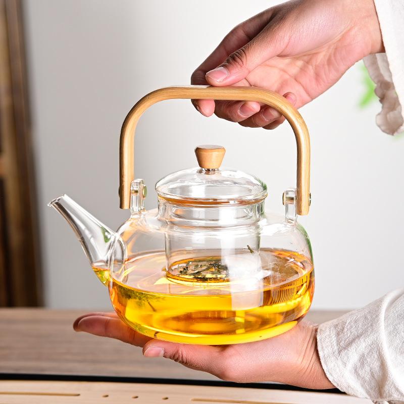 Tea Pot with Bamboo and Wood Handles Made of Borosilicate Glass Tea Cups Set and Capable of Open Flame Tea and Water Separation