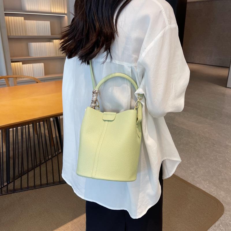 New fashionable versatile solid color bucket bag portable shoulder oblique span women's bag