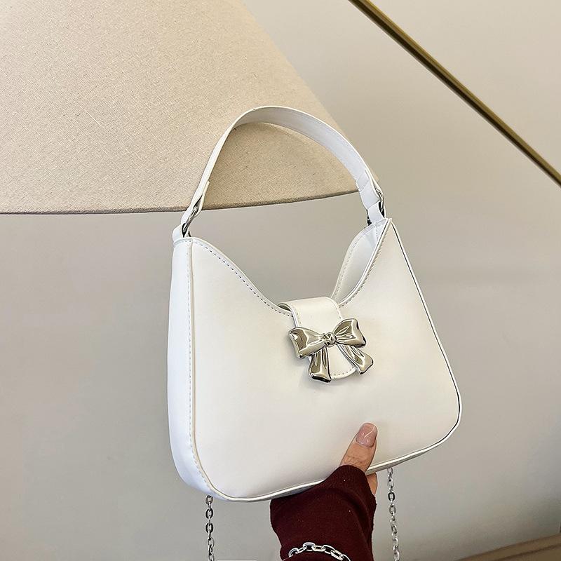 Borsa a mano da donna con fiocco tinta unita dolce 2025 nuova alla moda di nicchia borsa a spalla borsa a tracolla con catena