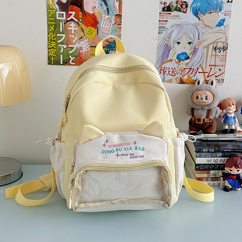 Le nouveau sac d'école est de grande valeur, frais et doux, sac à dos couleur bonbon, sac à dos léger et de grande capacité pour les collégiens.