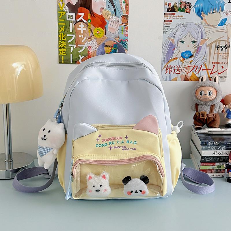Le nouveau sac d'école est de grande valeur, frais et doux, sac à dos couleur bonbon, sac à dos léger et de grande capacité pour les collégiens.