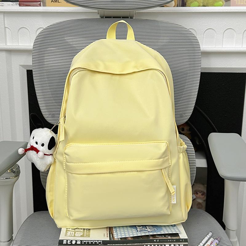 Schoolbag schoolbag female college student Korean version ins large capacity simple solid color backpack junior high school student backpack boys and