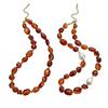 Elegant Irregular Beaded Red Resin Necklace Providing Adjustable Chain For Perfect Fit And Stylish Accessory In Stainless Steel Alloy.