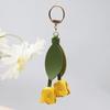 Beliebter blumenförmiger Anhänger PU-Leder Metallzubehör Taschenanhänger Schlüsselanhänger für Frauen Geschenk Blumen-Taschenanhänger