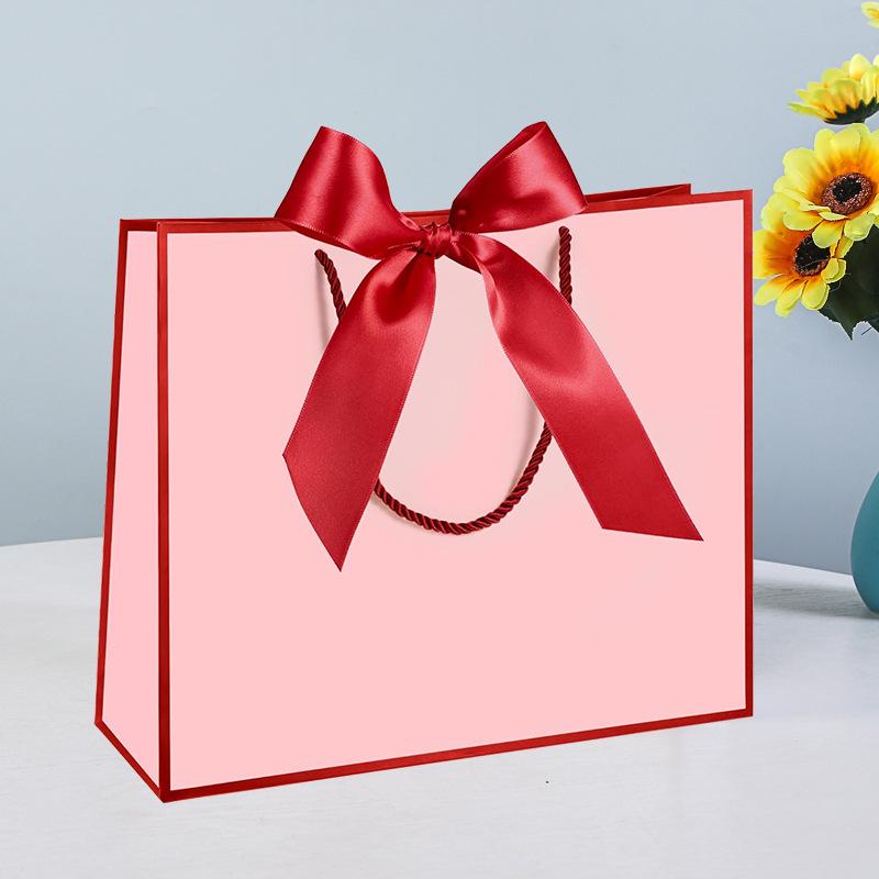 In-Stock White Cardboard Gift Bags with Bow Handle, Customizable Logo for Clothing Stores
