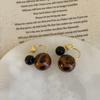 A Pair Of Leopard Print Resin Ball Stud Earrings For Women'S Maillard Style, Elegant And Fashionable Commuter Earrings And Earrings.