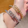 Luxe armband met meerdere cirkels in slangenbotmotief, open armband voor mannen en vrouwen, geschikt voor stellen.