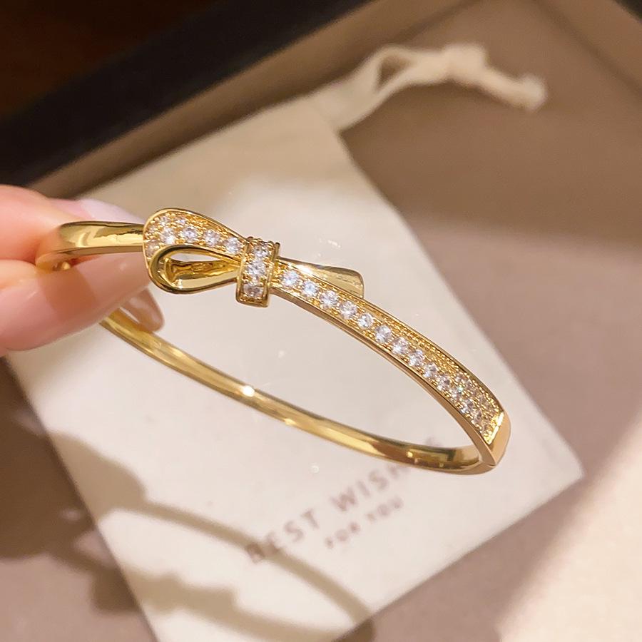 18k Gold Plated Oval Bracelet with Diamond Inlay - Butterfly Knot Design